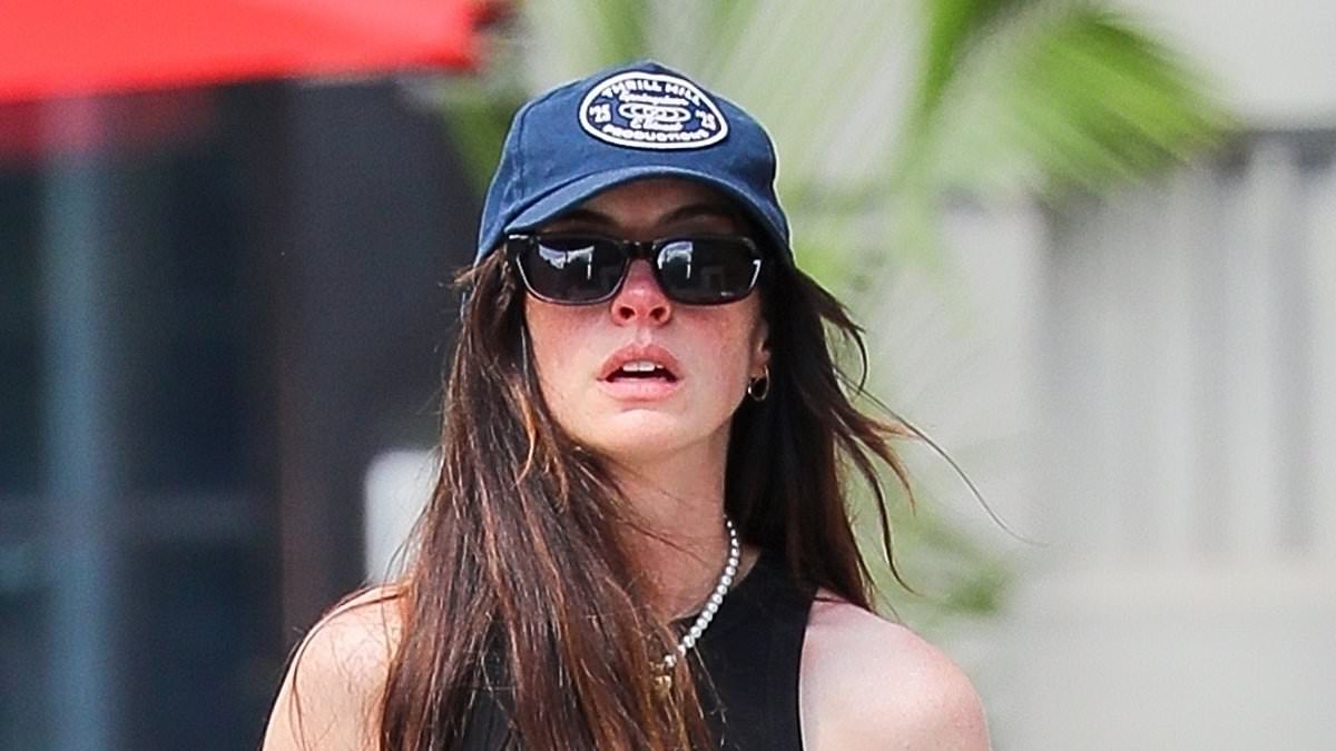 alert-–-anne-hathaway-displays-her-fashion-forward-sense-of-style-in-quirky-chain-cutout-jeans-as-she-steps-out-with-husband-adam-shulman-in-new-york