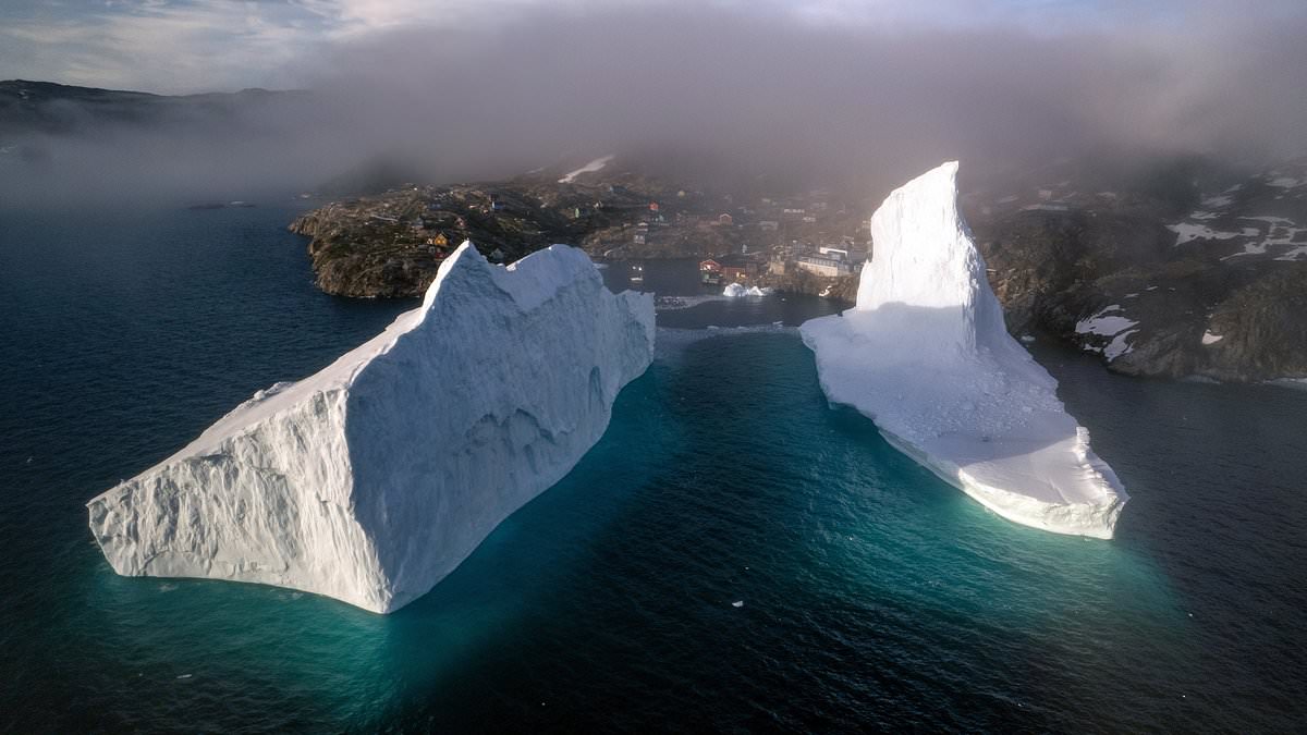 alert-–-iceberg-right-ahead!-amazing-images-show-skyscraper-sized-frozen-blocks-drifting-towards-houses-on-greenland’s-shores