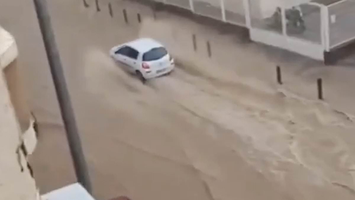 alert-–-rain-in-spain!-flood-and-hail-warning-as-holiday-hotspot-is-deluged-–-while-britain-basks-in-the-sun