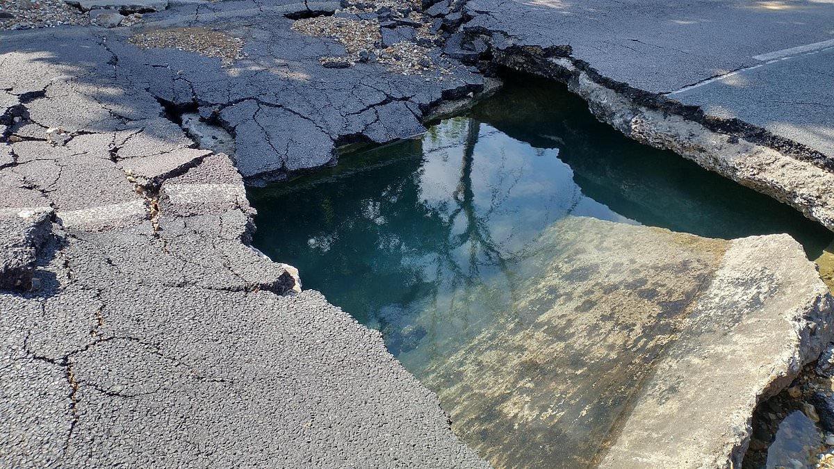 alert-–-massive-sinkhole-opens-up-in-busy-uk-street-after-burst-pipe-causes-major-flooding