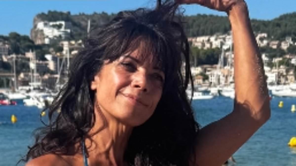 alert-–-jenny-powell,-57,-shows-off-her-age-defying-figure-in-a-blue-bikini-as-she-enjoys-beach-day-during-sun-soaked-spain-getaway