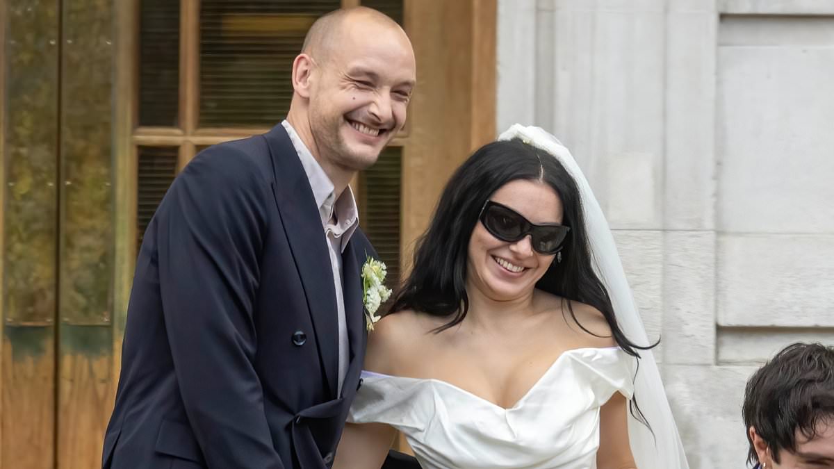 alert-–-charli-xcx-is-married!-brat-singer-stuns-in-a-leggy-white-mini-dress-and-her-trademark-shades-as-she-ties-the-knot-with-the-1975-star-george-daniel-–-but-bandmate-matty-healy-is-noticeably-absent