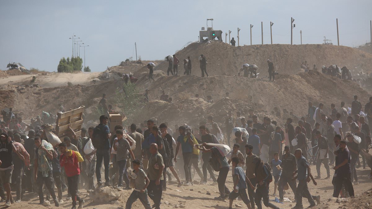 alert-–-un-posts-video-of-hundreds-of-palestinians-swarming-around-their-cars-‘and-gunshots-fired-near-crowds’-at-gaza-aid-site-amid-escalating-hamas-israel-war-of-words-over-‘starvation’-crisis