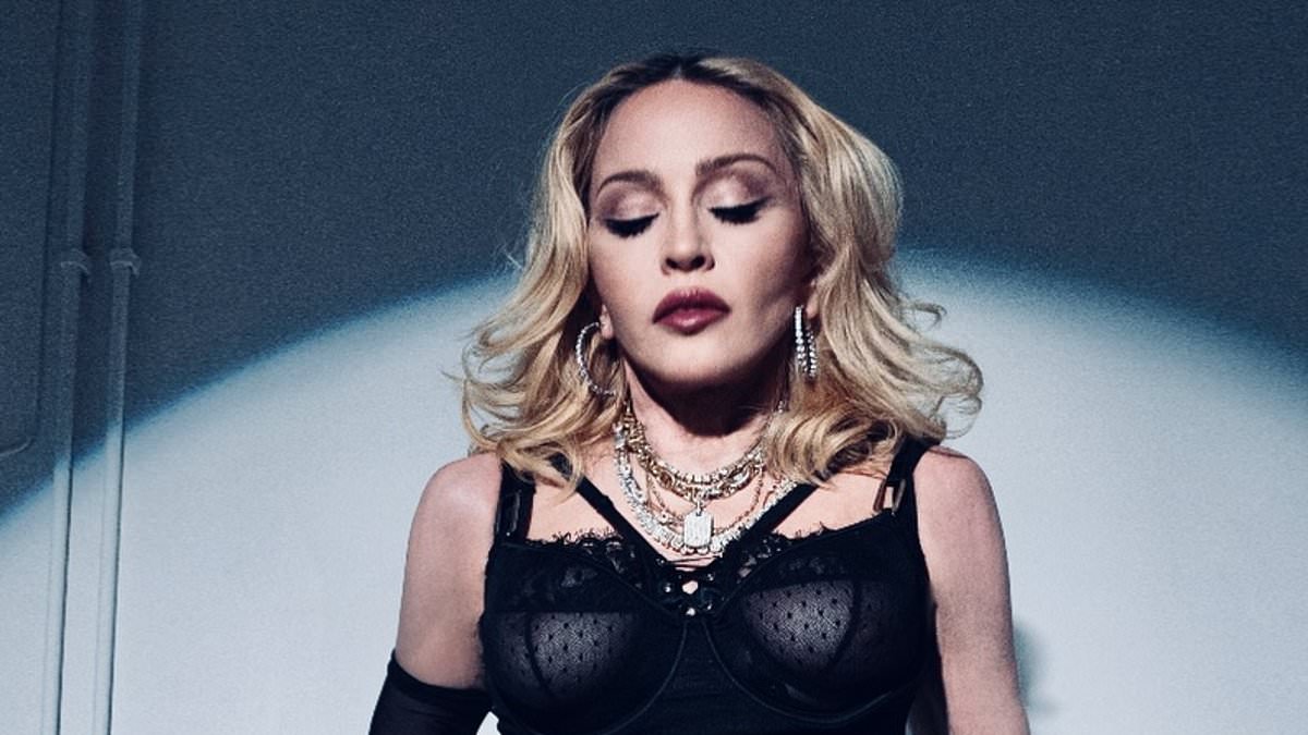 alert-–-madonna-pays-tribute-to-cher-in-a-racy-outfit-as-she-goes-braless-in-a-semi-sheer-lace-bodysuit