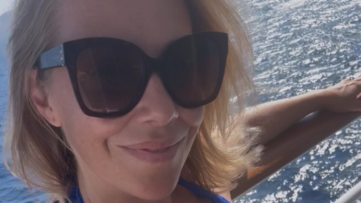 alert-–-a-place-in-the-sun’s-laura-hamilton,-43,-defiantly-shows-off-her-figure-in-blue-swimwear-after-hitting-back-at-trolls-insisting-she-is-‘too-old-to-wear-a-bikini’