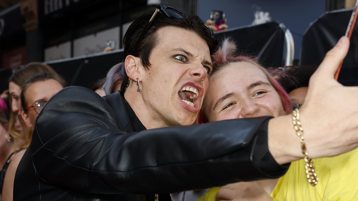 alert-–-yungblud-is-supported-by-his-mother-at-his-are-you-ready,-boy?-premiere-as-the-rocker-puts-on-a-very-animated-display-while-taking-selfies-with-fans