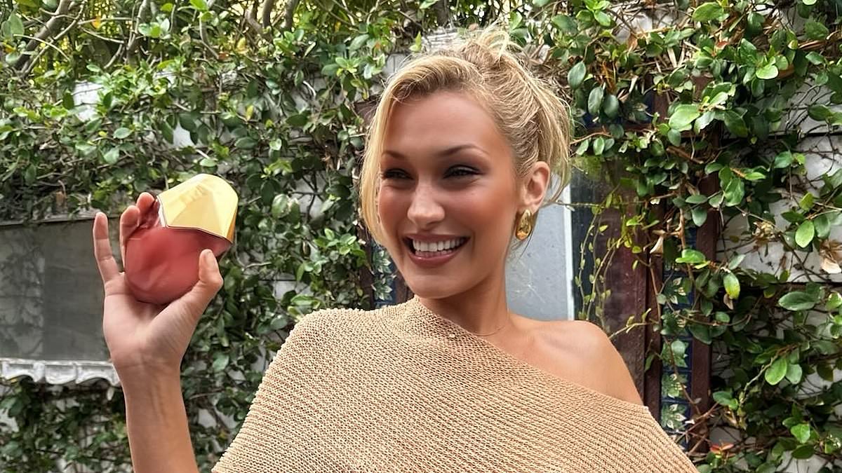alert-–-bella-hadid-goes-braless-under-a-semi-sheer-cropped-shawl-as-she-launches-latest-perfume