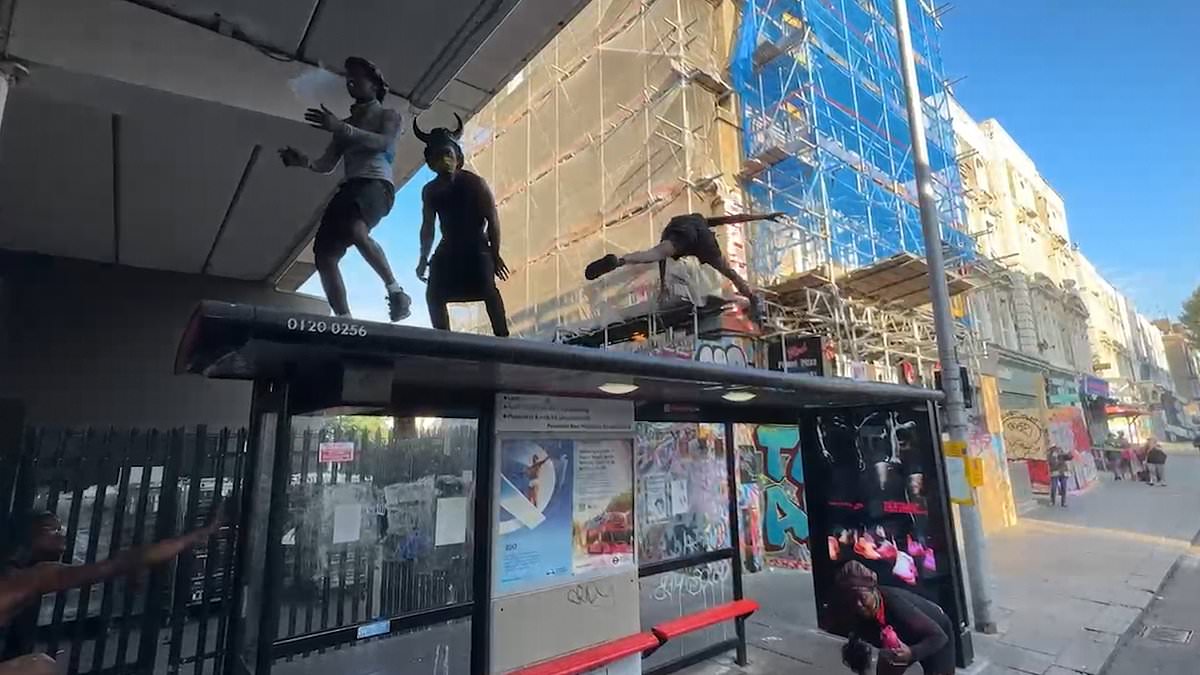 alert-–-notting-hill-carnival-revellers-dance-on-the-top-of-a-bus-stop-as-thousands-kick-off-celebrations-at-dawn